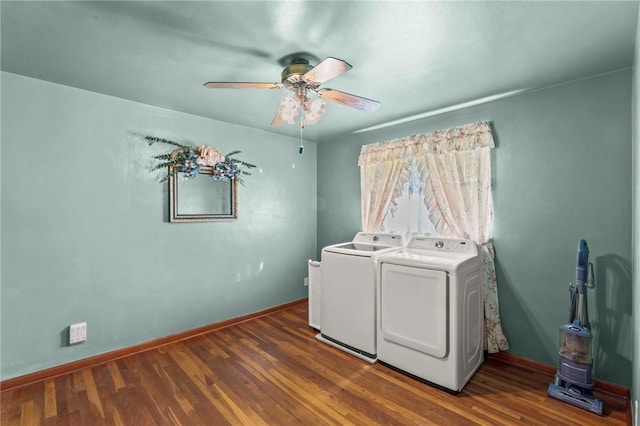 clothes washing area featuring independent washer and dryer, a ceiling fan, wood finished floors, baseboards, and laundry area