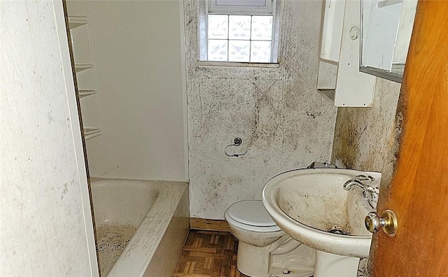 bathroom featuring toilet and a sink