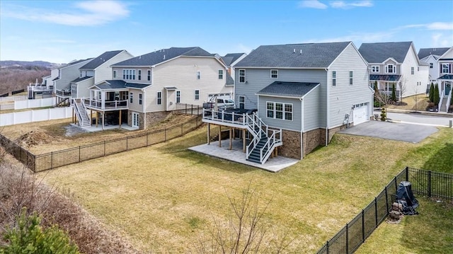 rear view of property featuring stairway, a residential view, and a fenced backyard