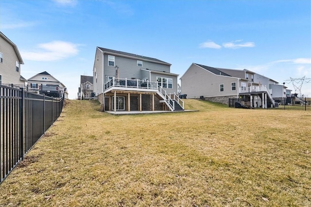 back of house with a residential view, stairs, a yard, a fenced backyard, and a deck