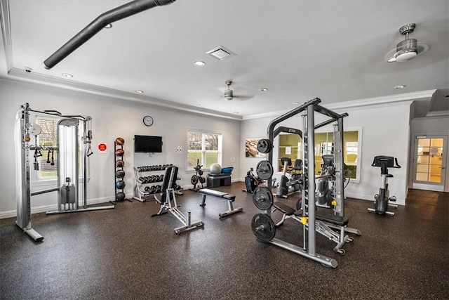 exercise room featuring a ceiling fan, ornamental molding, baseboards, and visible vents