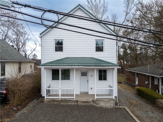 view of front of home with covered porch and metal roof