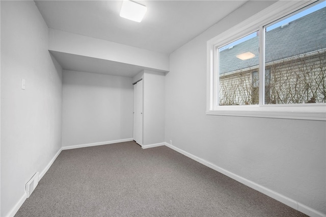 bonus room featuring visible vents, carpet floors, and baseboards