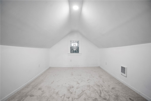 bonus room featuring visible vents, baseboards, carpet flooring, and vaulted ceiling