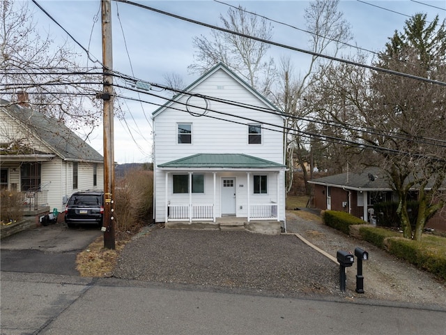 view of front of house featuring a porch and driveway