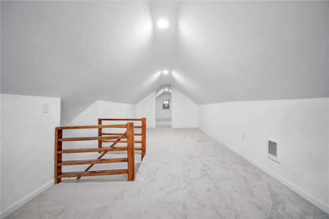 bonus room featuring visible vents, baseboards, carpet, and vaulted ceiling