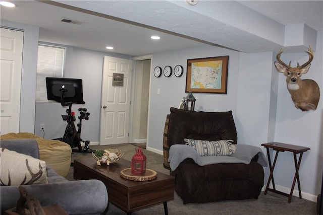 carpeted living room with visible vents, recessed lighting, and baseboards