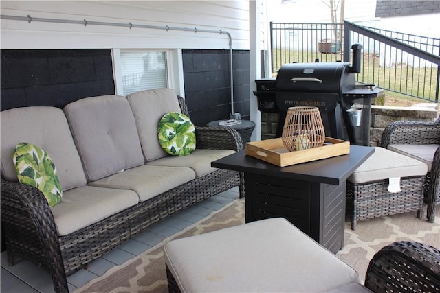 view of patio / terrace featuring an outdoor living space, fence, and grilling area