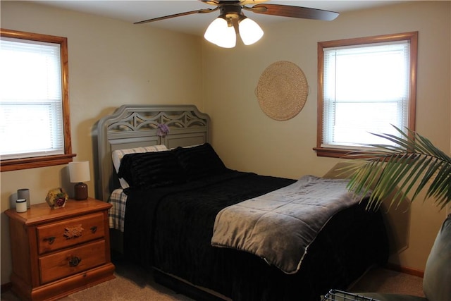 carpeted bedroom with ceiling fan