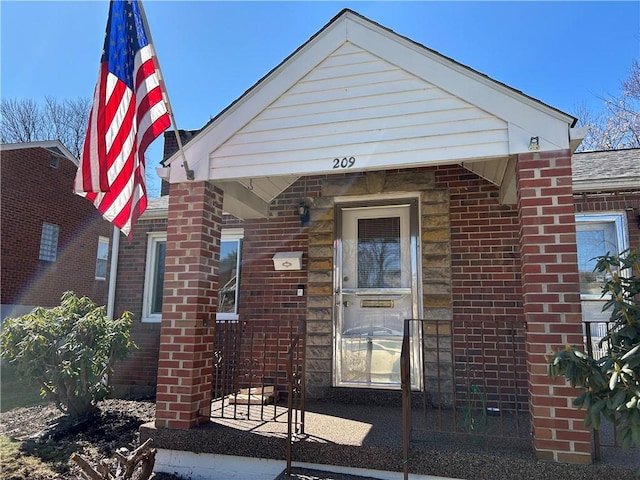 view of front of home featuring brick siding