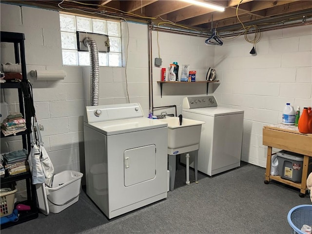 clothes washing area with washer and dryer and laundry area