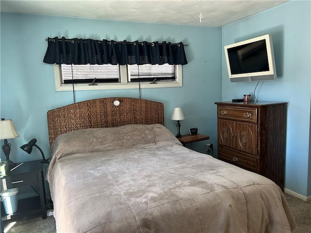 bedroom with baseboards and carpet flooring