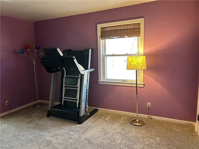 exercise area with carpet and baseboards