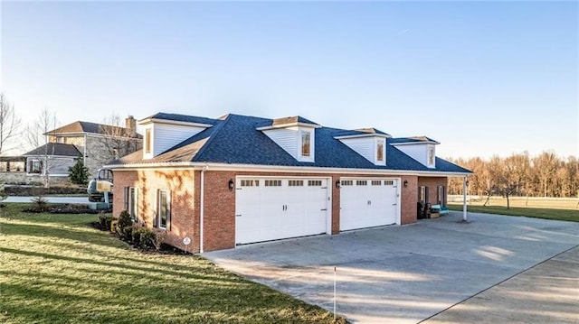 view of home's exterior featuring brick siding, a lawn, driveway, and a garage