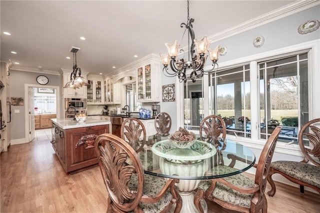 4605 Whippoorwill Dr, Hermitage, PA 16148 - dining space with a chandelier, recessed lighting, light wood-style flooring, and ornamental molding