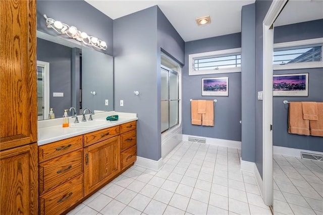 4605 Whippoorwill Dr, Hermitage, PA 16148 - full bathroom featuring vanity, tile patterned floors, and combined bath / shower with glass door