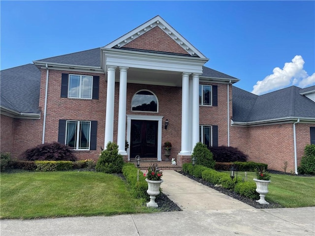 4605 Whippoorwill Dr, Hermitage, PA 16148 - neoclassical home with a front lawn, brick siding, and roof with shingles