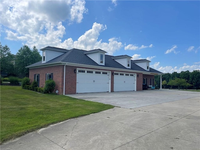 4605 Whippoorwill Dr, Hermitage, PA 16148 - view of side of property with brick siding, a garage, driveway, and a yard