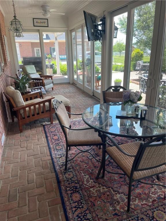 4605 Whippoorwill Dr, Hermitage, PA 16148 - sunroom with a ceiling fan and outdoor dining area