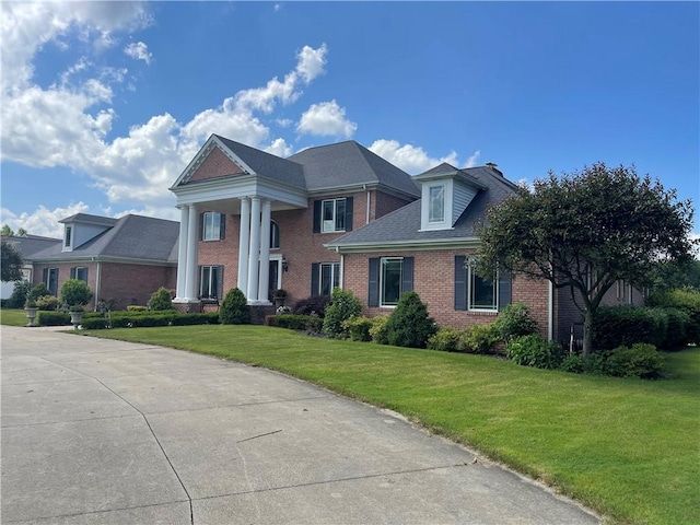 4605 Whippoorwill Dr, Hermitage, PA 16148 - neoclassical / greek revival house with brick siding and a front yard