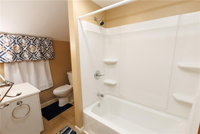 bathroom with tile patterned floors, toilet, a sink, shower / bathing tub combination, and baseboards