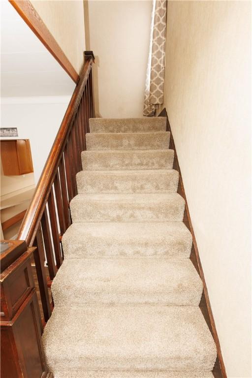 stairway with baseboards