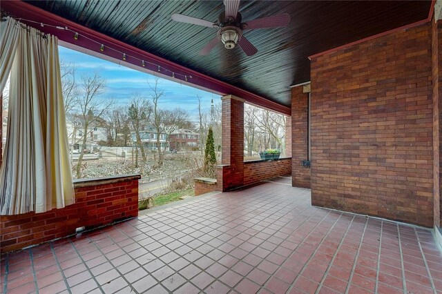 view of patio featuring ceiling fan