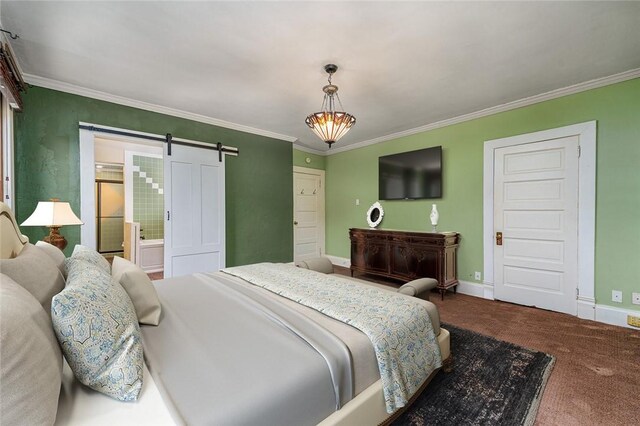 bedroom with a barn door, baseboards, carpet, and ornamental molding