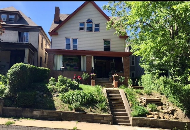 traditional style home featuring stairway