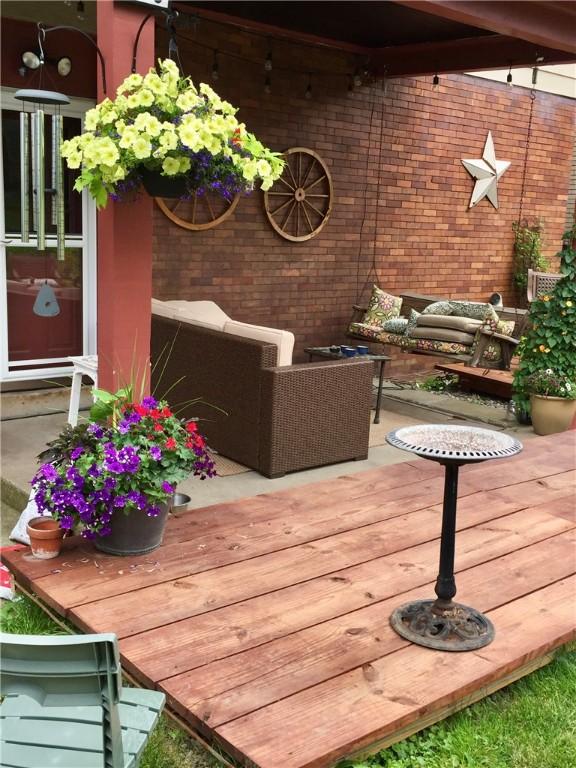 wooden terrace with outdoor lounge area