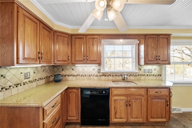 kitchen with black dishwasher, brown cabinets, and a sink