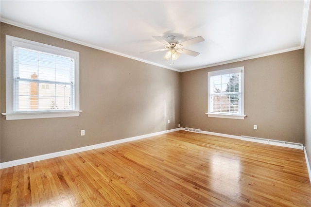 unfurnished room featuring baseboards, visible vents, light wood-style flooring, ceiling fan, and crown molding