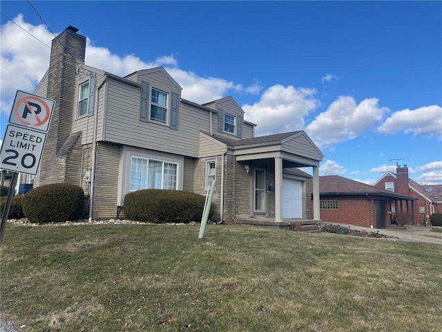 view of front of house featuring an attached garage, a chimney, and a front yard