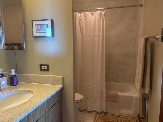 full bathroom featuring tile patterned floors, shower / bath combination with curtain, toilet, and vanity