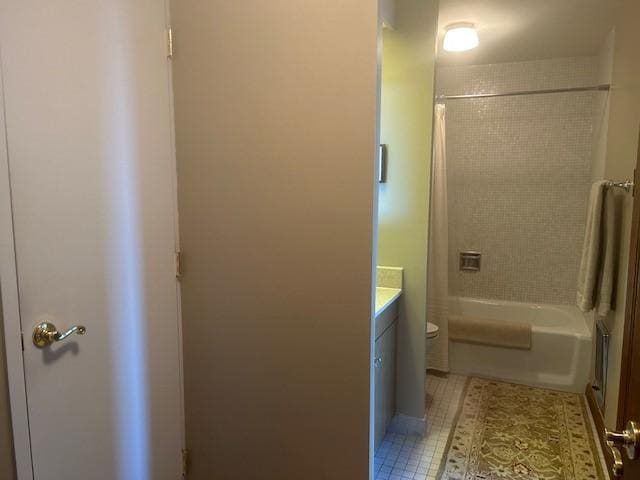 full bathroom with vanity, tile patterned floors, toilet, and shower / bath combo