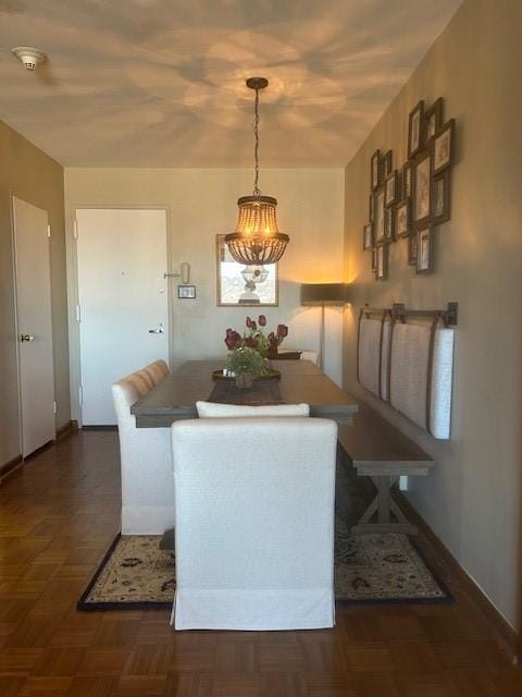 dining area featuring baseboards