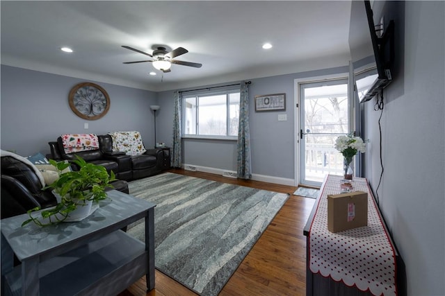 living room featuring recessed lighting, ceiling fan, baseboards, and wood finished floors