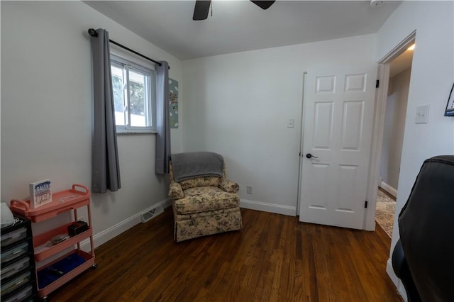 living area with ceiling fan, visible vents, baseboards, and wood finished floors