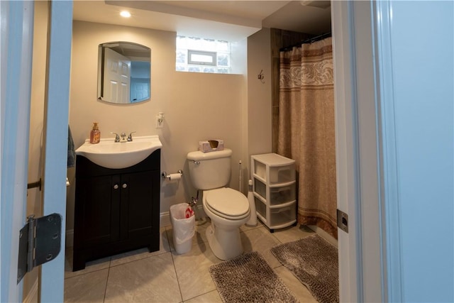 full bath featuring tile patterned flooring, a shower with shower curtain, toilet, and vanity