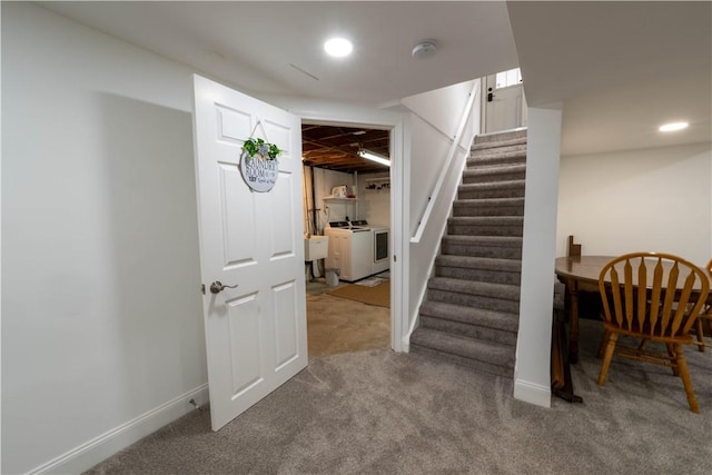 stairway with washing machine and dryer, recessed lighting, baseboards, and carpet floors