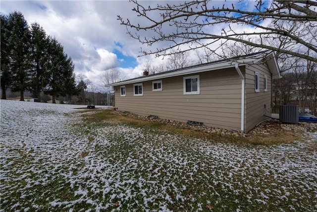 view of side of home featuring crawl space and cooling unit