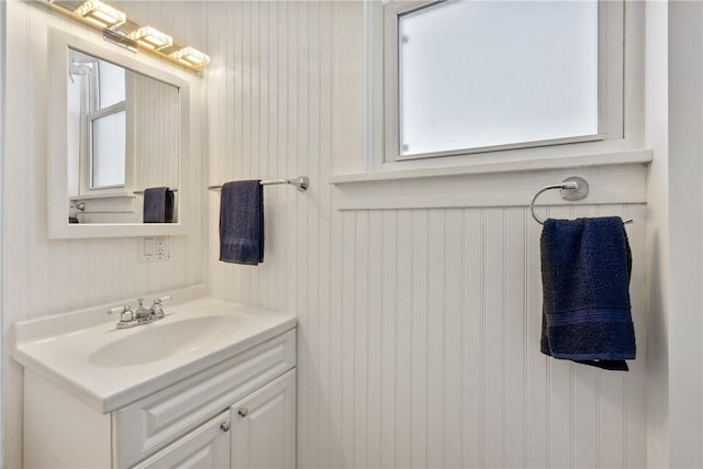 bathroom with a healthy amount of sunlight and vanity