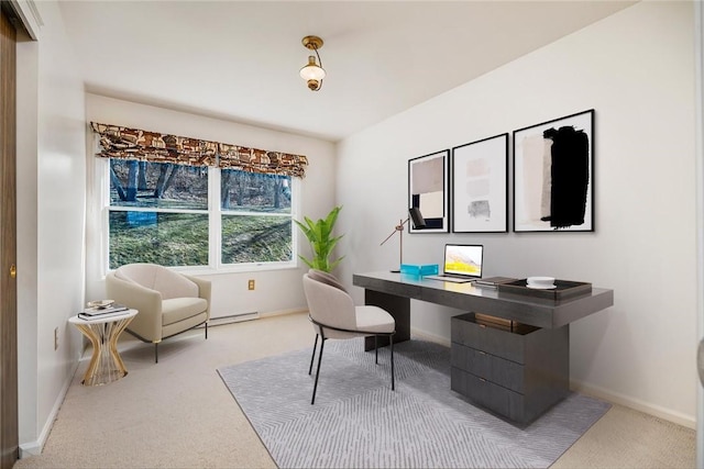 office area with light colored carpet, a baseboard heating unit, and baseboards