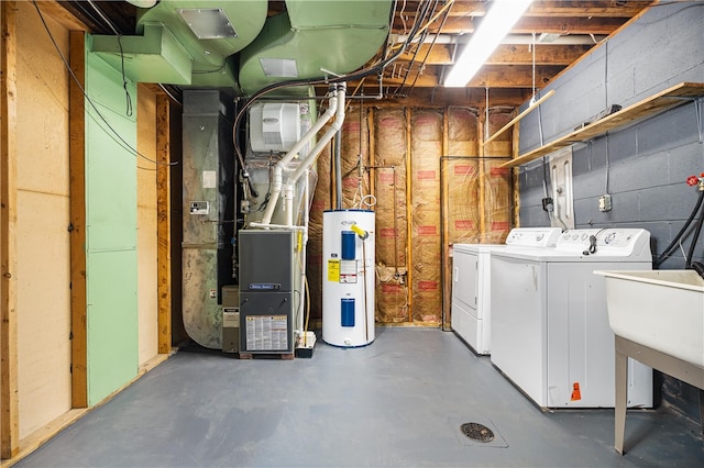 unfinished below grade area featuring a sink, heating unit, water heater, separate washer and dryer, and concrete block wall