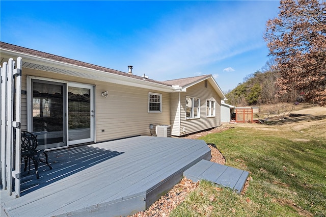 wooden deck featuring a yard and central AC