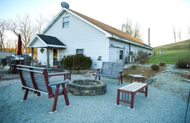 back of house featuring a patio area and an outdoor fire pit