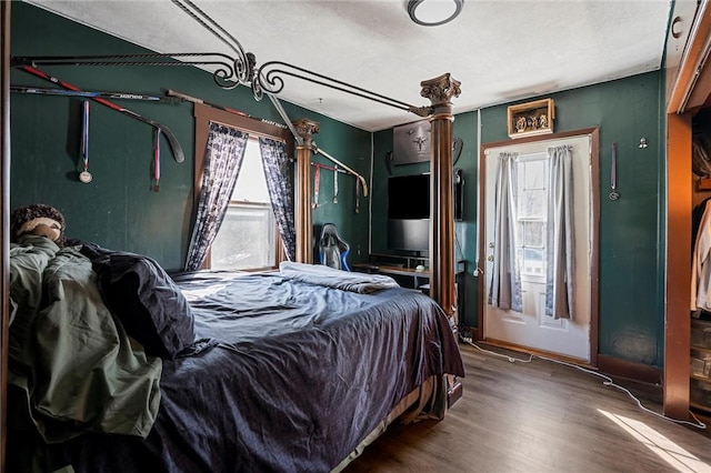 bedroom with wood finished floors