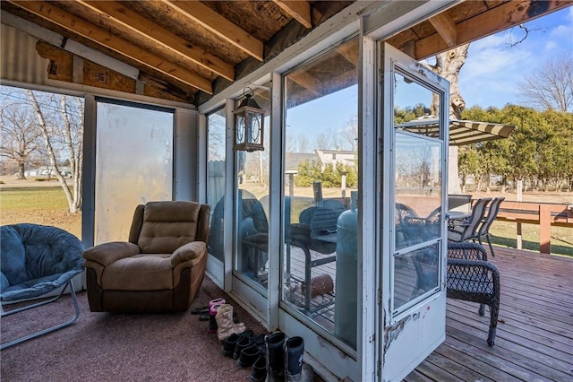 sunroom / solarium with vaulted ceiling