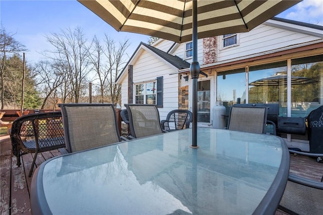 wooden deck with outdoor dining space