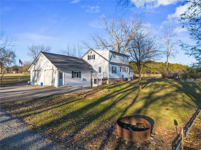 exterior space featuring a yard and a garage